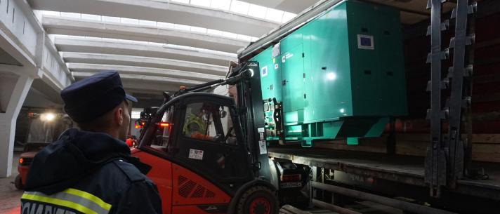 Generator being unloaded from a truck.