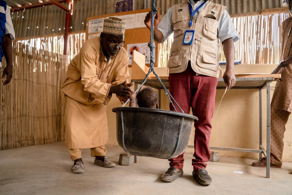 A child during the weighing.